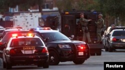 Police officers are seen at the scene of a shooting near a polling station in Azusa, California, Nov. 8, 2016. 