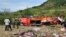 Kenyan police and other rescuers attend the scene of a bus crash near Kericho in western Kenya Wednesday, Oct. 10, 2018. 