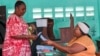 A woman votes in a referendum on whether to adopt a new constitution, in Libreville, Gabon, on Nov. 16, 2024.
