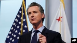 In this April 9, 2020 photo, Gov. Gavin Newsom gives his coronavirus update. The governor said California plans to spend $1 billion to buy 500 million masks with the idea of distributing them throughout the western U.S. 