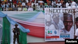 FILE - A soldier stands guard during a launch campaign by the ruling All Progressives Congress (APC) party for President Muhammadu Buhari's re-election bid, in Uyo, Nigeria, Dec. 28, 2018.