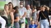 FILE - People line up to enter a grocery store in Brisbane, Australia, Jan. 8, 2021. 