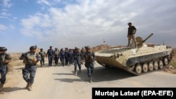 IRAQ -- Iraqi federal police forces take up position in Rashad town, southern Kirkuk, October 13, 2017