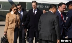 Hope Hicks, (L), an advisor to U.S. President Donald Trump, White House special assistant Nicholas Luna (2nd L), President Trump's senior adviser, Jared Kushner, and White House staffers depart Washington.