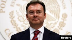 FILE - Mexico's Finance Minister Luis Videgaray looks on after handing in fiscal reforms to congressmen at the Congress building in Mexico City, September 2013.