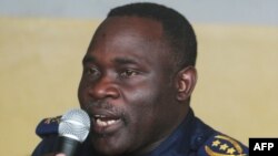 FILE - Former Kinshasa police chief, John Numbi, speaks while in court, Jan. 27, 2011.