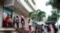 People line up at a money exchange office in Havana, Cuba, Dec. 18, 2019. 