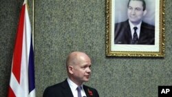 British Foreign Secretary William Hague, looks on during a presser under a poster showing Egyptian President Hosni Mubarak at the Foreign ministry in Cairo, Egypt (File Photo).