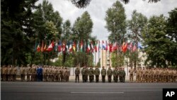 Romanian military personnel stand in formation during a speech by NATO Secretary General Jens Stoltenberg at the site of the first NATO Force Integration Unit in Bucharest, Romania, July 2, 2015.