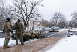 National Guard soldiers stand their post on the House side of the U.S. Capitol, Feb. 1, 2021, in Washington.