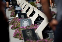 FILE - Graves are seen at the memorial cemetery for Georgian soldiers killed during the war with Russia over the breakaway region of South Ossetia in 2008 in Tbilisi, Georgia, Aug. 8, 2017.