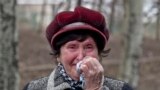 A woman cries as she waits to hear news about relatives after an explosion at the Zasyadko coal mine in Donetsk, Ukraine. Seventeen workers were confirmed dead and 16 are still missing.