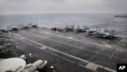 F18 aircrafts are parked on U.S. Navy aircraft carrier USS NIMITZ 