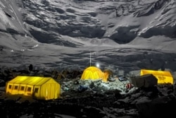This photo taken May 17, 2021, shows mountaineer's tents lit up at night at Camp 2 of Mount Everest, in Nepal. (Lakpa Sherpa)