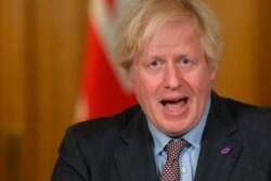 Britain's Prime Minister Boris Johnson gives a COVID-19 briefing from Downing Street in London, Jan. 27, 2021.