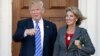  President-elect Donald Trump, left, and Betsy DeVos, right, pose for photographs at Trump National Golf Club Bedminster's clubhouse in Bedminster, N.J.