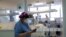FILE - Nurse Eva Fiori updates a medical record of a patient suffering from the coronavirus disease (COVID-19) at the Intensive Care Unit (ICU) of Emilio Ribas Institute in Sao Paulo, Brazil, June 17, 2020. 