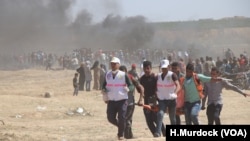 Protests in response to the U.S. Embassy opening in Jerusalem turned deadly as protesters rushed the borders despite Israeli fire and tear gas, in Gaza, May 14, 2018.