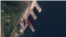 라진항을 촬영한 16일 자 위성사진에 대형 선박(원 안)이 보인다. 사진=Planet Labs