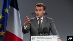 FILE—French President Emmanuel Macron speaks at the inauguration of a French Cultural Center in the capital Kigali, Rwanda, May 27, 2021. In a key speech on his visit to Rwanda, Macron said he recognizes that France bears a heavy responsibility for the 1994 genocide there.