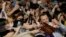 Actor Simon Pegg takes a selfie with fans during a promotional event for his latest film "Star Trek Beyond" in Seoul, South Korea, Aug. 16, 2016.