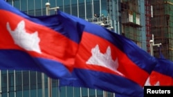 FILE - Cambodia's national flags are seen in Phnom Penh, Cambodia, Oct. 7, 2016. 