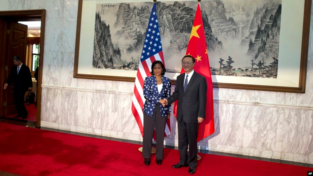 Penasihat Keamanan Nasional AS Susan Rice bersama Konselor China Yang Jiechi di Beijing (8/9). (AP/Ng Han Guan)