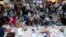 Anti-government protesters eat as they break their fast on the first day of the holy month of Ramadan at Taksim Square in Istanbul, Turkey, July 9, 2013. 