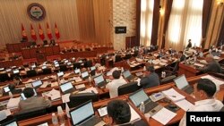 Parliament members attend a session in Bishkek, June 20, 2013.