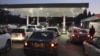 Motorists wait to fill up their tanks at a fuel station in Harare, Tuesday, Oct, 9, 2018. As Zimbabwe plunges into its worst economic crisis in a decade, gas lines are snaking for hours, prices are spiking and residents goggle as the new government insist