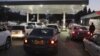 Motorists wait to fill up their tanks at a fuel station in Harare. (AP)