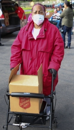 The Salvation Army in Huntington, California helps a senior citizen with food. (The Salvation Army USA)