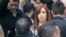 FILE - Former Argentine President Cristina Fernandez de Kirchner leaves court in Buenos Aires, April 13, 2016, after refusing to testify in a state fraud probe. On Thursday, Argentine police searched three of her properties seeking documents.