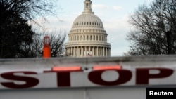 FILE - A security barricade is placed in front of the U.S. Capitol on the first day of a partial federal government shutdown in Washington, Dec. 22, 2018.