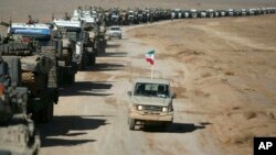 This photo provided Jan. 25, 2019 by the Iranian Army shows an infantry drill in the central Isfahan province, Iran. (Iranian Army via AP)