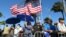 Pro-statehood supporters await the arrival of Puerto Rico's new governor at the seaside Capitol in San Juan, Puerto Rico, Jan. 2, 2017.