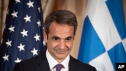 Greek Prime Minister Kyriakos Mitsotakis appears at a reception, at the State Department in Washington, Jan. 8, 2020.