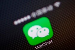 FILE - A picture illustration shows a WeChat app icon in Beijing, Dec. 5, 2013.