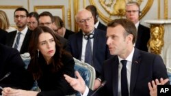 French President Emmanuel Macron and New Zealand's Prime Minister Jacinda Ardern attend a meeting at the Elysee Palace, May 15, 2019 in Paris. Several world leaders and tech bosses are meeting to find ways to stop acts of violent extremism from being shown online.