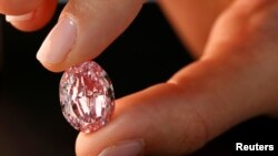FILE - "The Spirit of the Rose" is a 14.83-carat vivid purple-pink diamond. It sold at auction Nov. 11, 2020, in Geneva for $26.6 million.