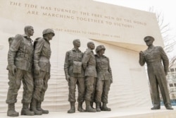 A group of statues at the memorial recreates the photo of Gen. Dwight D. Eisenhower speaking with paratroopers before they go to battle. (Courtesy - Eisenhower Memorial Commission)