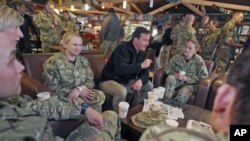 Britain's Prime Minister David Cameron meets with British soldiers at Kandahar airfield during a previously unannounced visit to Afghanistan, December 20, 2011.
