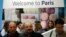 Visitors browse the exhibition stand of French capital Paris at the International Tourism Trade Fair (ITB) in in Berlin, Germany, March 9, 2016. 