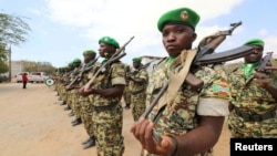 FILE - Burundian African Union Mission in Somalia peacekeepers stand in formation during a ceremony as they prepare to leave the Jaale Siad Military Academy after being replaced by the Somali military in Mogadishu, Somalia, Feb. 28, 2019.