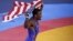 Jordan Burroughs of U.S. celebrates after defeating Iran's Sadegh Saeed Goudarzi in the final of the men's 74Kg freestyle wrestling at the ExCel venue during the London 2012 Olympic Games, August 10, 2012.