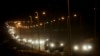 FILE - A convoy of Israeli armored military vehicles leaves the Gaza Strip through the Kissufim crossing into Israel, Sept. 12, 2005. Israel said Nov. 8, 2024, that it is preparing to open the crossing amid pressure for more humanitarian aid in the Gaza Strip.