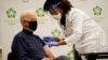President-elect Joe Biden receives his first dose of the coronavirus vaccine at ChristianaCare Christiana Hospital in Newark, Del., Monday, Dec. 21, 2020, from nurse practitioner Tabe Mase.