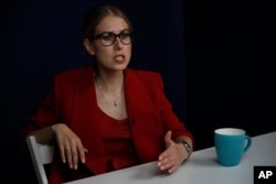 FILE - Russian opposition activist Lyubov Sobol speaks during an interview with the Associated Press in Moscow, Russia, Aug. 15, 2019.