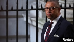 Foreign Secretary James Cleverly walks outside Number 10 Downing Street in London