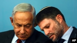 FILE - Israeli Prime Minister Benjamin Netanyahu and Israeli Finance Minister Bezalel Smotrich hold a news conference at the Prime Minister's office in Jerusalem.